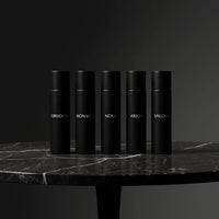 Thumbnail for Men’s luxury perfume discovery set arranged on a stone surface