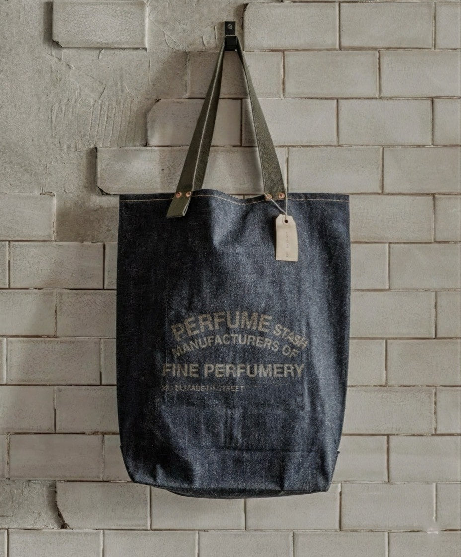 Luxury denim tote bag from The Perfume Stash London, showcasing elegant craftsmanship and minimalist design for perfume lovers in the UK